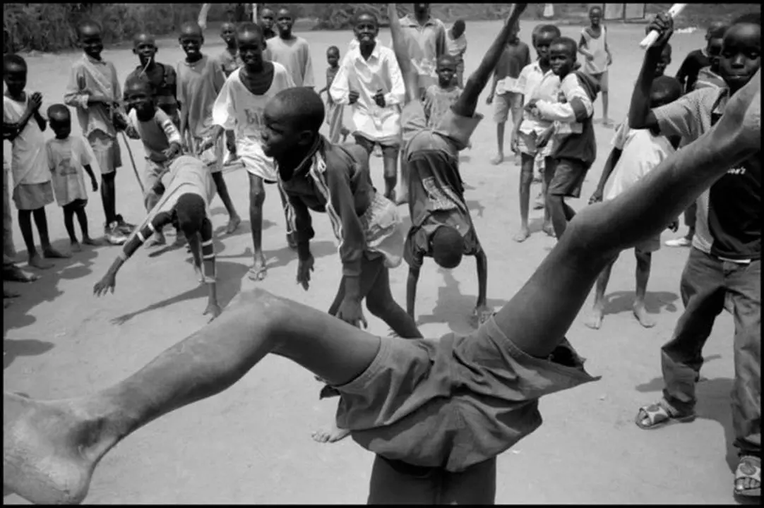 KENYA. Kakuma Refugee Camp. August 2001. Boys playing in the camp.