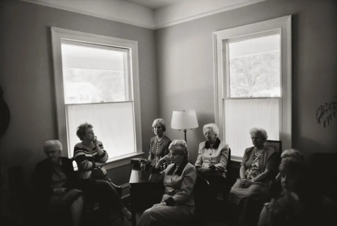 USA. Eau Claire, South Carolina. 1999. A woman's church group gathering at Reverend Wiley Cooper's house.