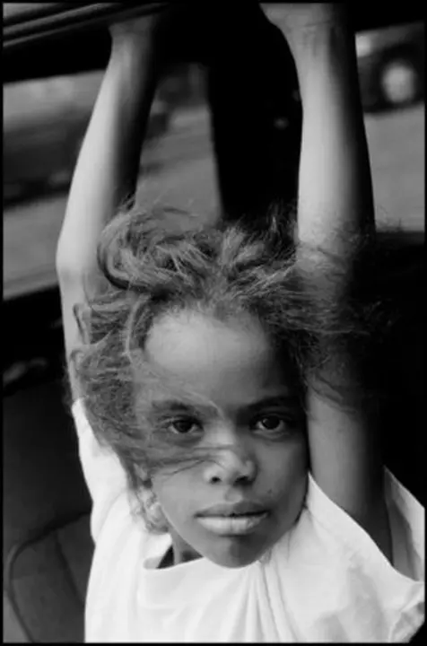 USA. Perth Amboy, New Jersey. 2000. A close-up of 8-year-old Lorraine Santiago on Oak Street.