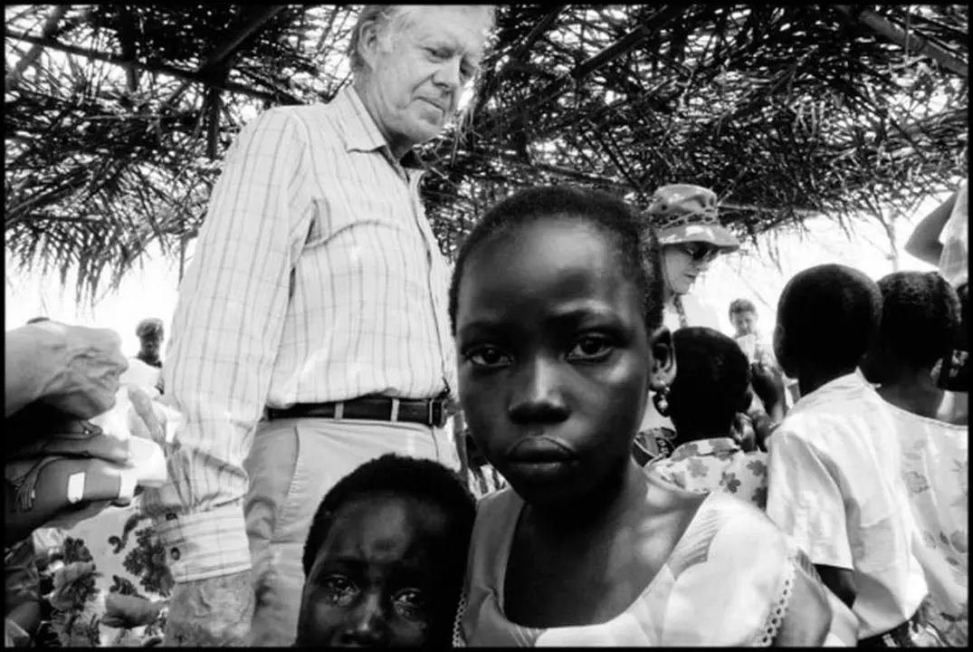 GHANA. 1989. Former President Jimmy CARTER in the village of Danchira.