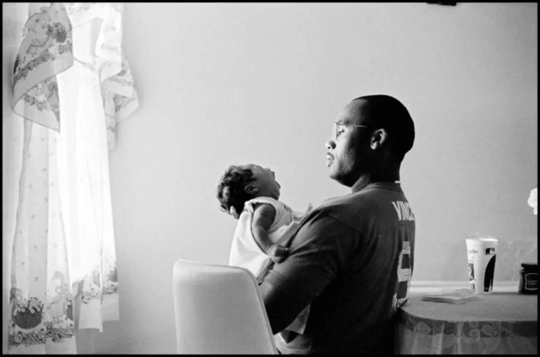 USA. Mississippi Delta. Father and new born son in the Mississippi delta.